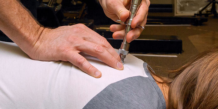 patient getting activator methods as an auto accident injury treatment in Delray Beach