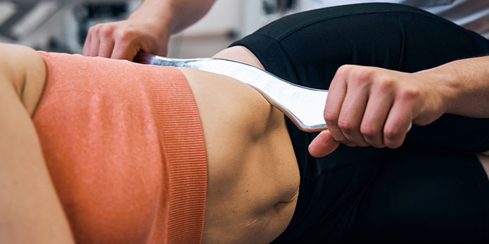 patient getting graston chiropractic as an auto accident injury treatment in Delray Beach