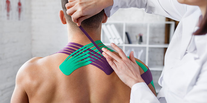 patient getting kinesio tape as an auto accident injury treatment in Delray Beach